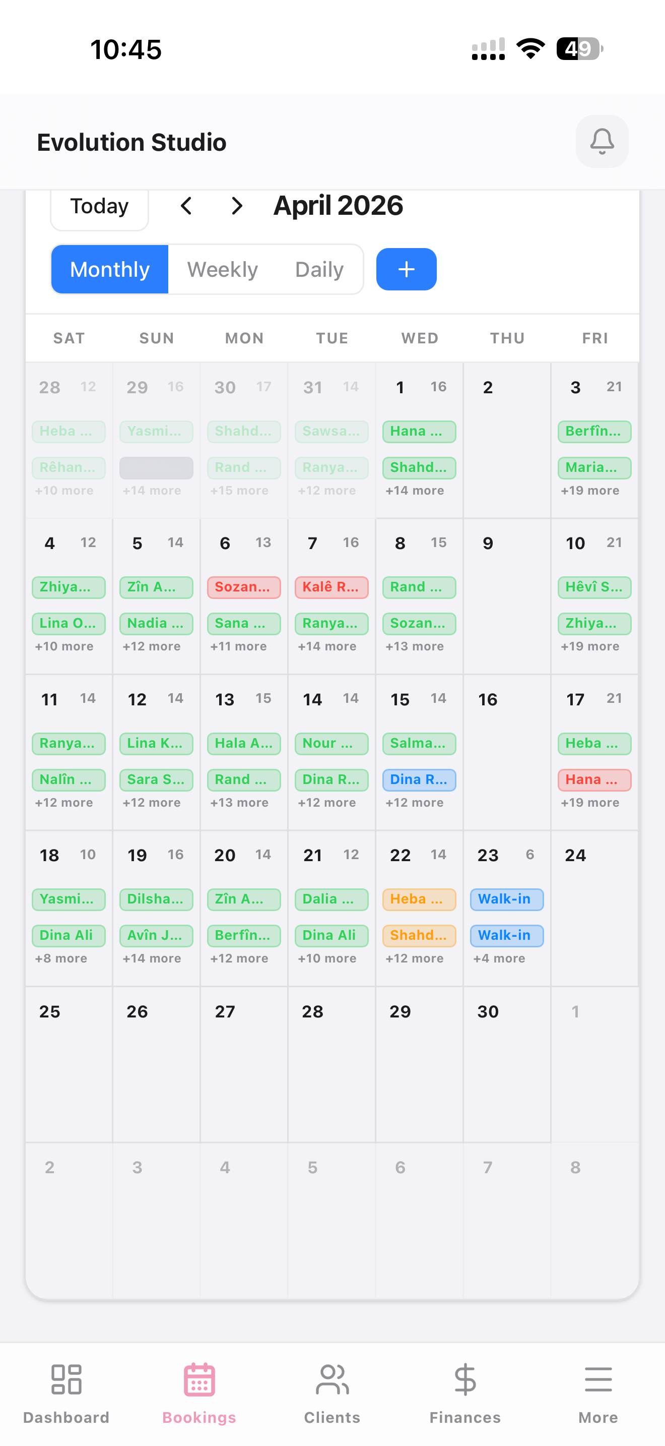 krd.beauty admin app on iPhone — the same monthly booking calendar with bottom tab bar (Dashboard, Bookings, Clients, Finances, More)